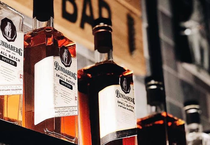Bundaberg Rum bottles lined up on shelf