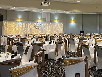 Large function room set up with beautiful wedding reception tables and decorations