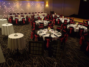 Large fancy party set up with red and black detailing