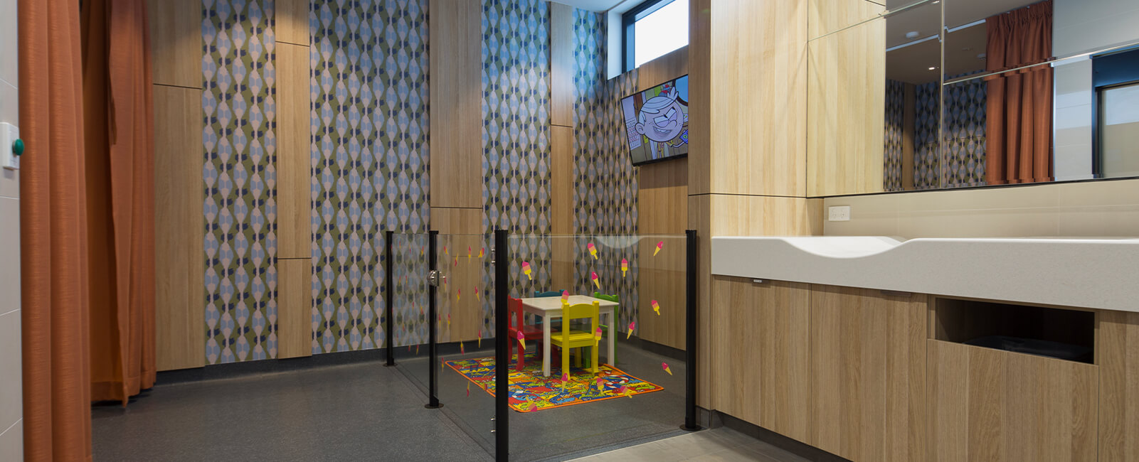 Wide shot of kids and parents facililties