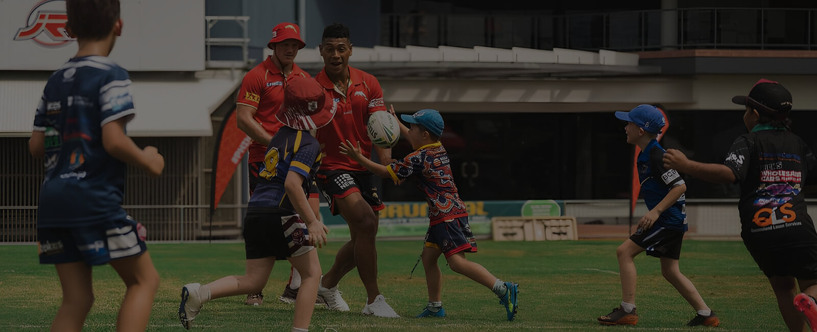 Young kids play sports with Dolphins NRL team members