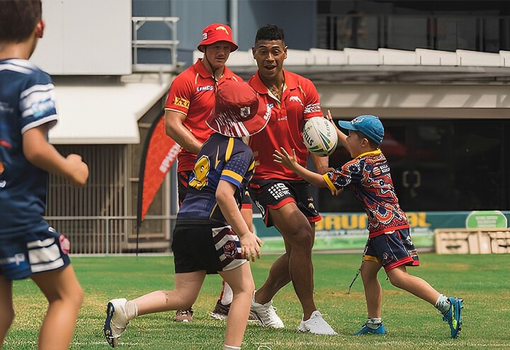 Dolphins NRL players during practice game with local sporting group