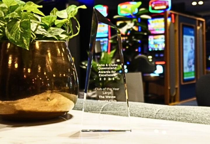 Award graphics for silver and gold on photo of club in background